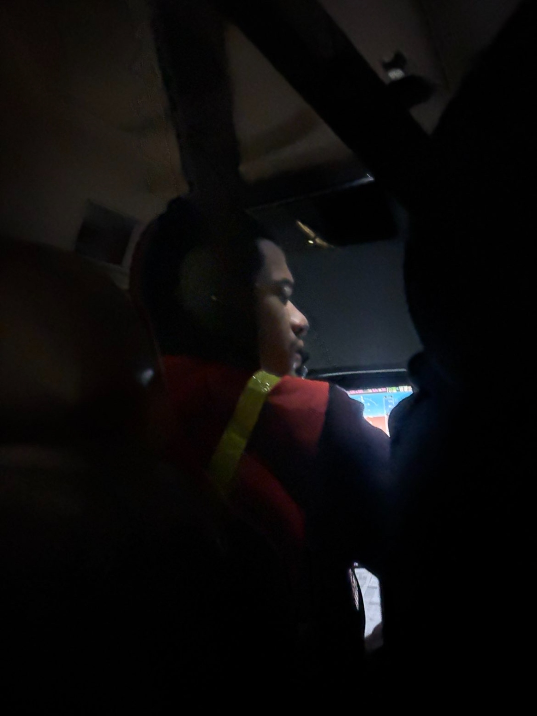 Tylor Russel in an aircraft cockpit wearing a pilot headset